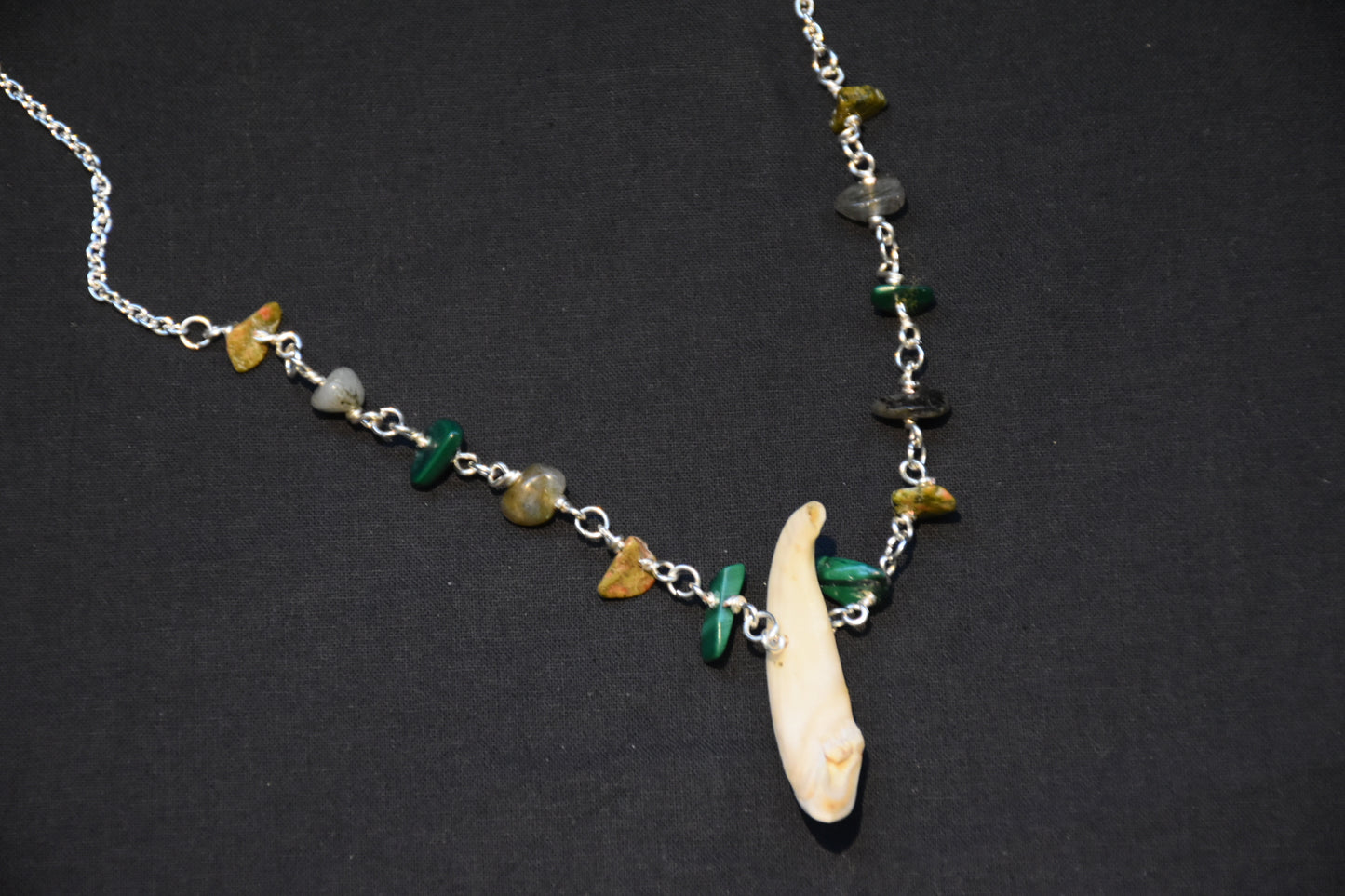 Crystal boar tusk necklaces