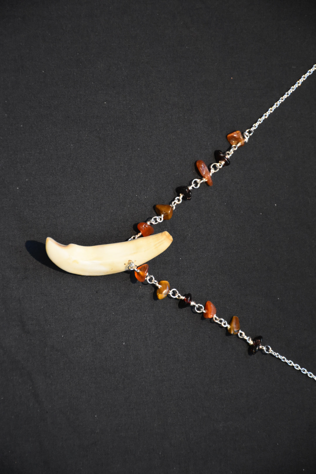 Crystal boar tusk necklaces