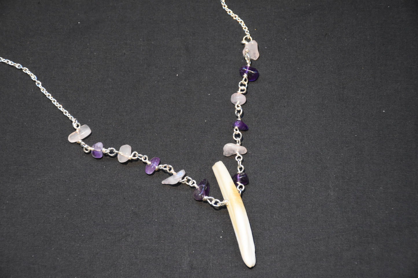 Crystal boar tusk necklaces