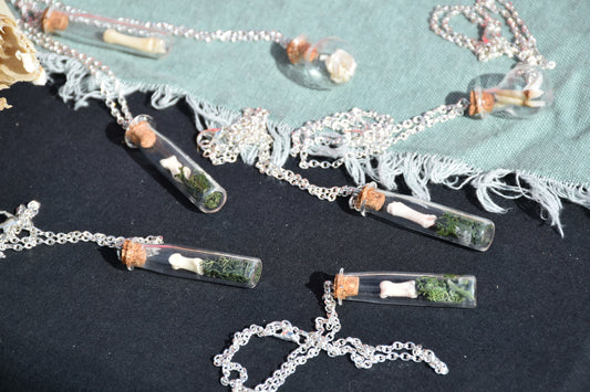 Mossy badger bone bottle necklace