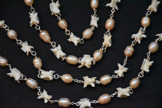 Pink pearl snake necklaces