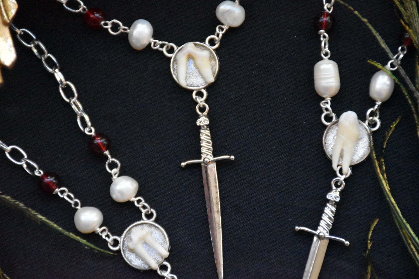 Sword tooth necklaces
