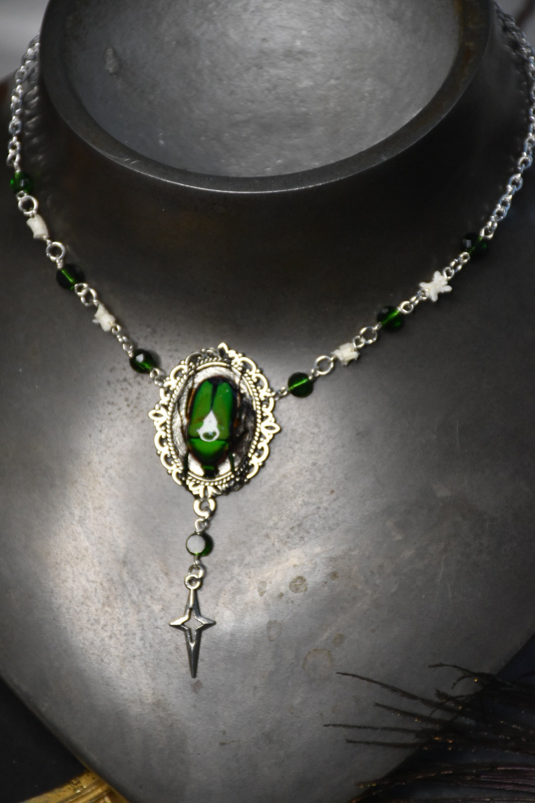 Snake bone beetle necklaces